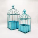 Two Metal Hanging Bird Blue Cage Set Cage on a Light Background.