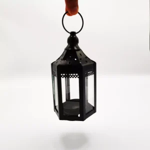 Black Decorative Mini Metal Lantern held by a hand.