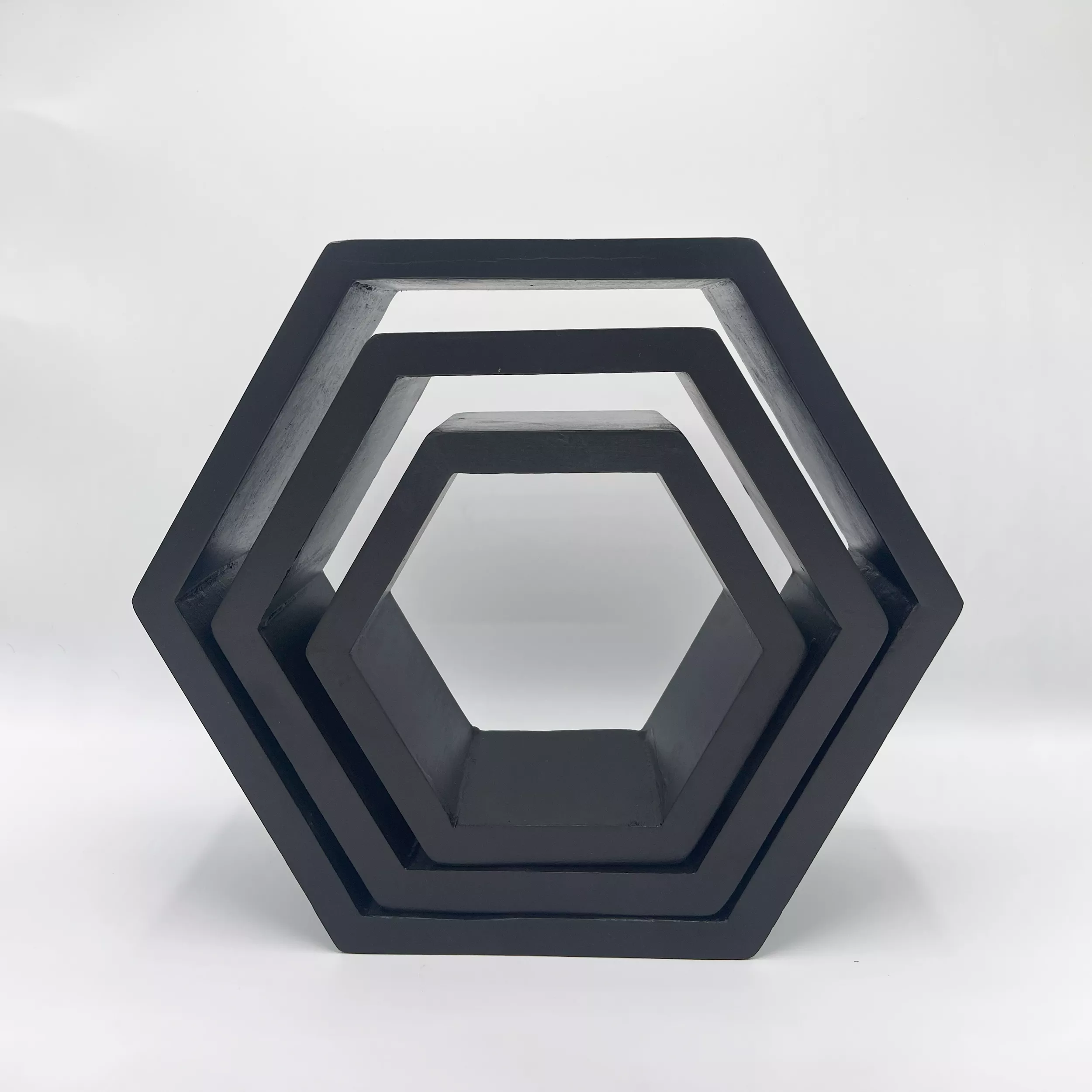 Black Wall Shelves hexagonal wood shelf with three nested tiers.